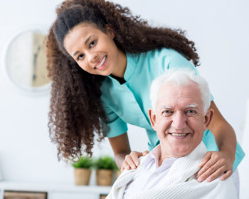 caregiver assisting her elderly patient