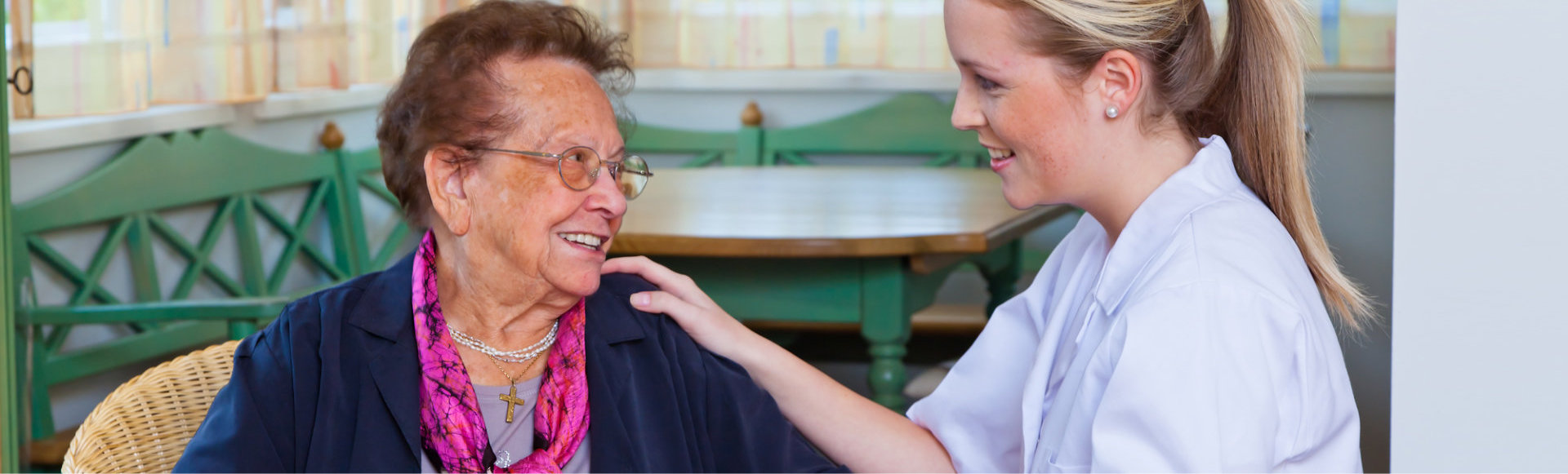 caregiver and medical staff looking each other